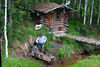 BillCath > After stopping in a dark "mine" [no pics], we pass a demo of gold panning...
